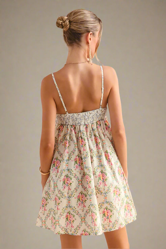 Woman wearing a floral dress against a soft beige background