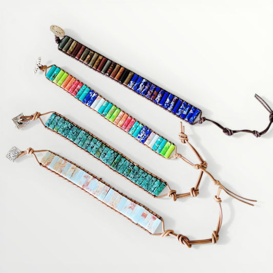 Set of colorful beaded bracelets on a white background