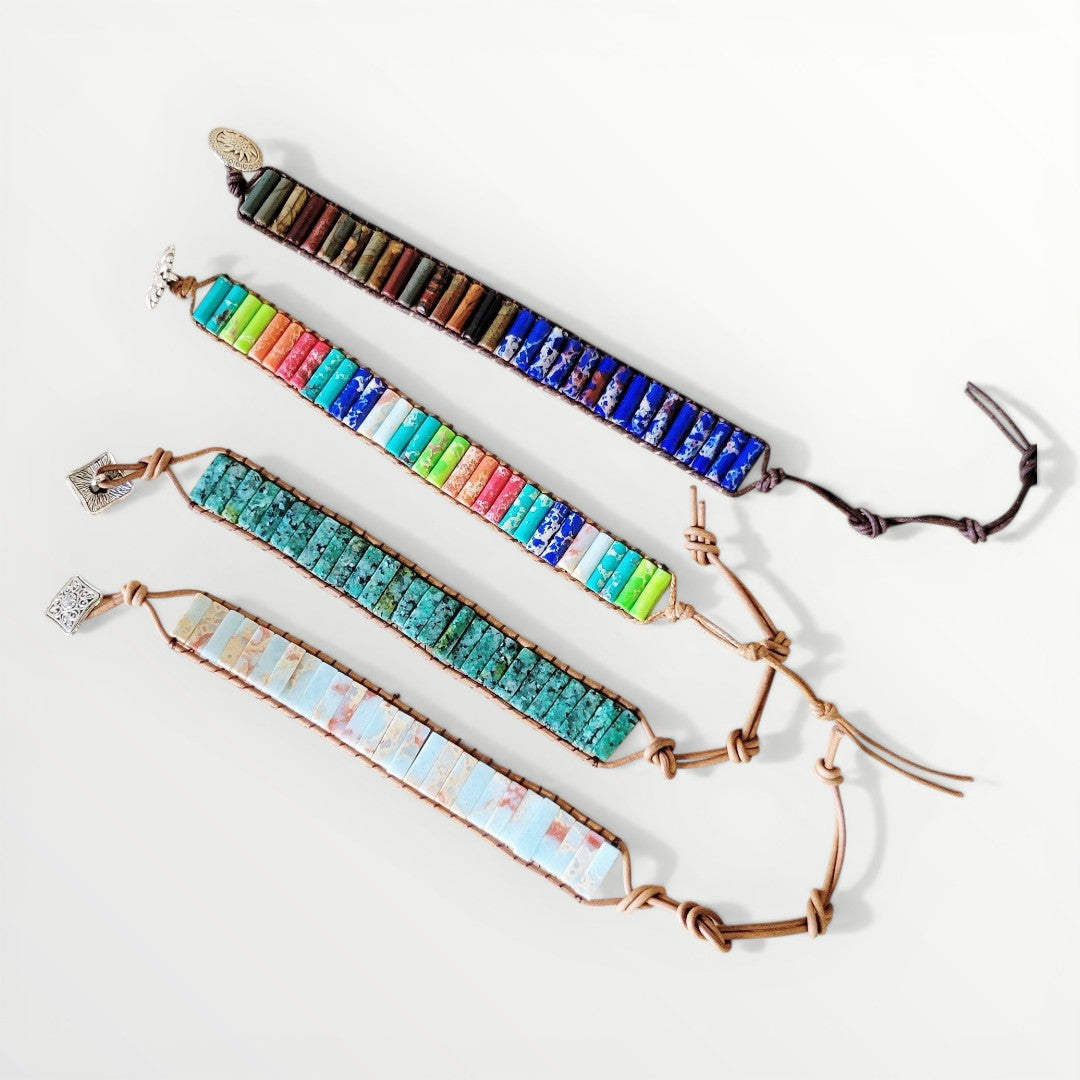 Set of colorful beaded bracelets on a white background