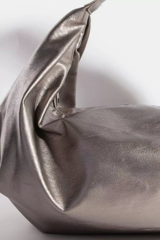 Metallic silver handbag on a light gray background