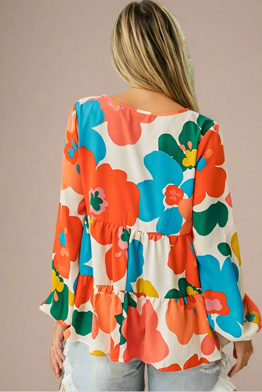 Woman wearing a colorful floral blouse