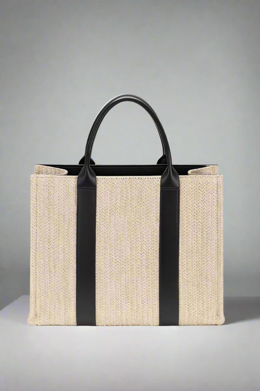 Beige tote bag with black straps on a white background