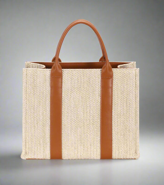 Tote bag with brown leather straps on a white background