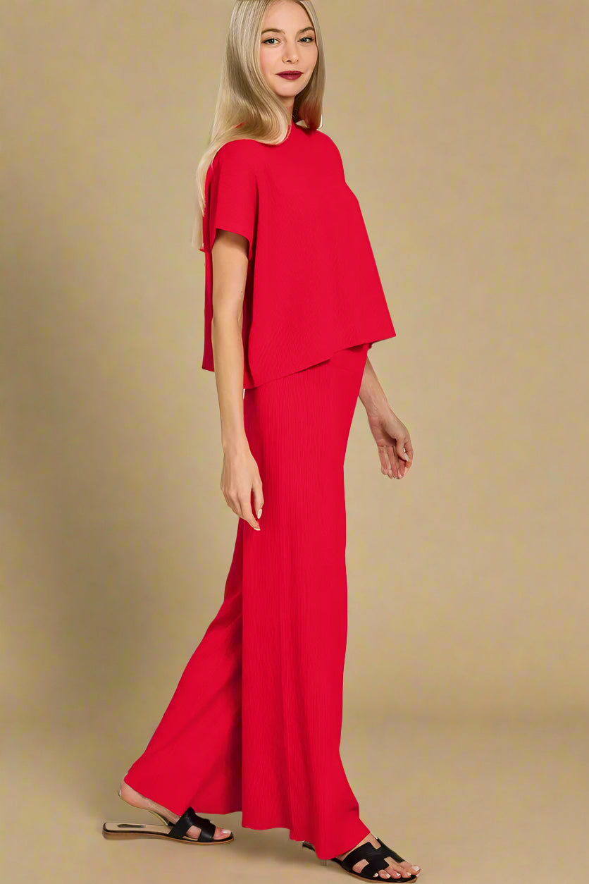 Woman wearing a red outfit on a white background