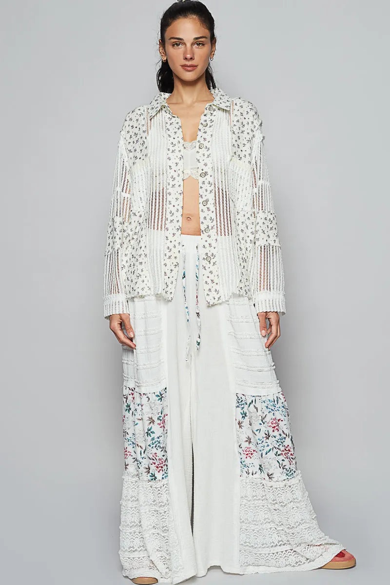 Woman wearing a white floral outfit on a gray background