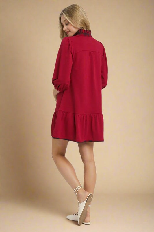 Woman wearing a red dress on a white background