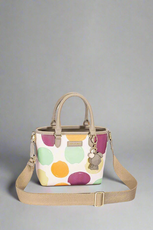 Handbag with colorful polka dot pattern on a white background