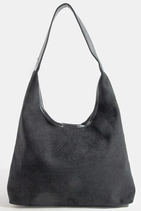 Black handbag on a white background