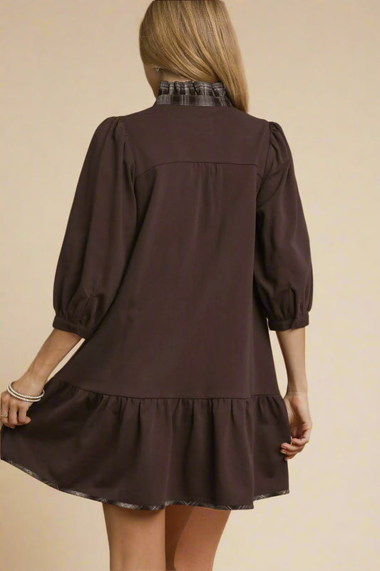 Brown dress with plaid collar on a brown background