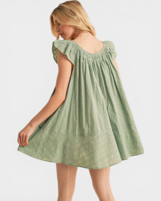Woman wearing a green dress on a white background