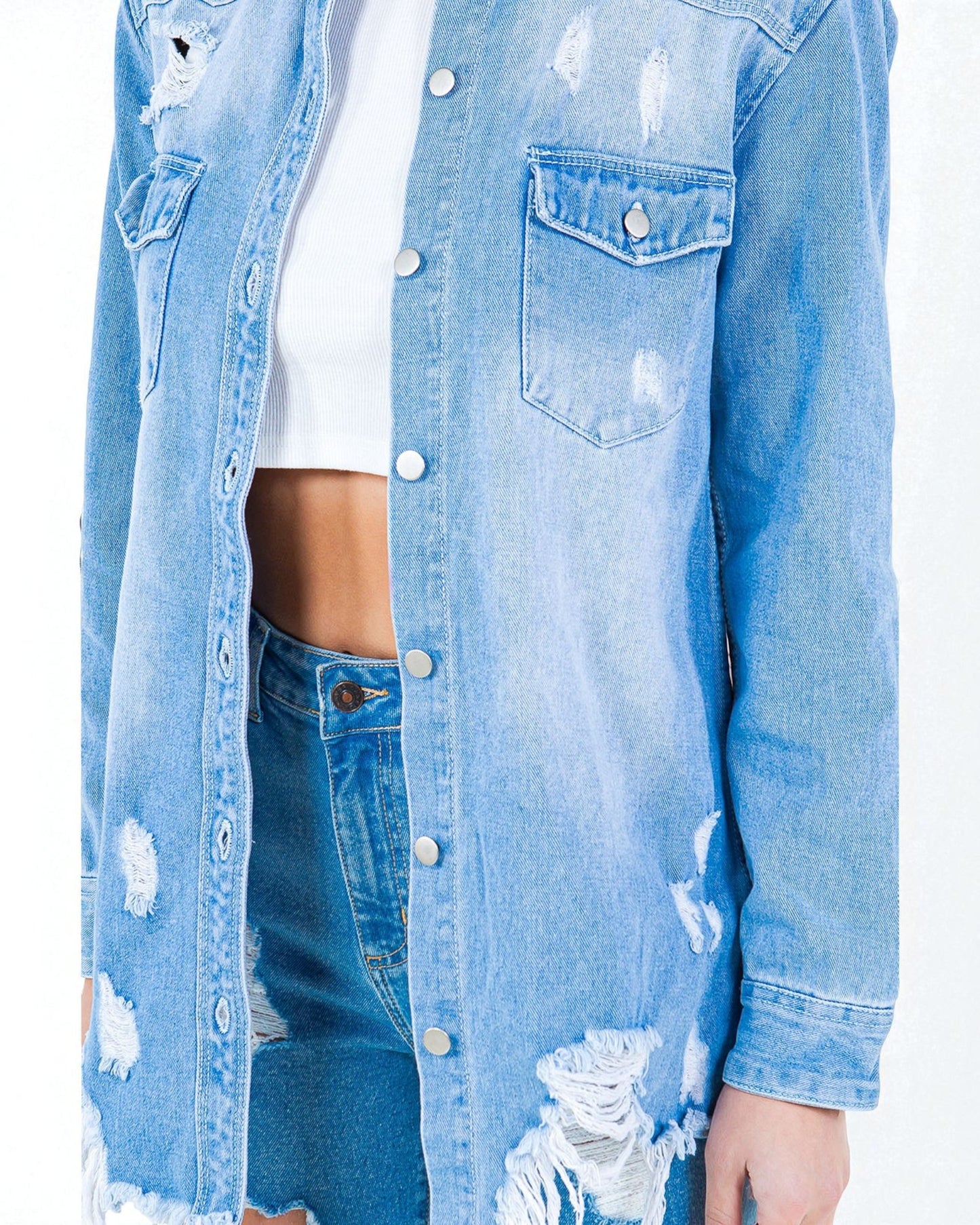 Light blue denim jacket with distressed details on a white background