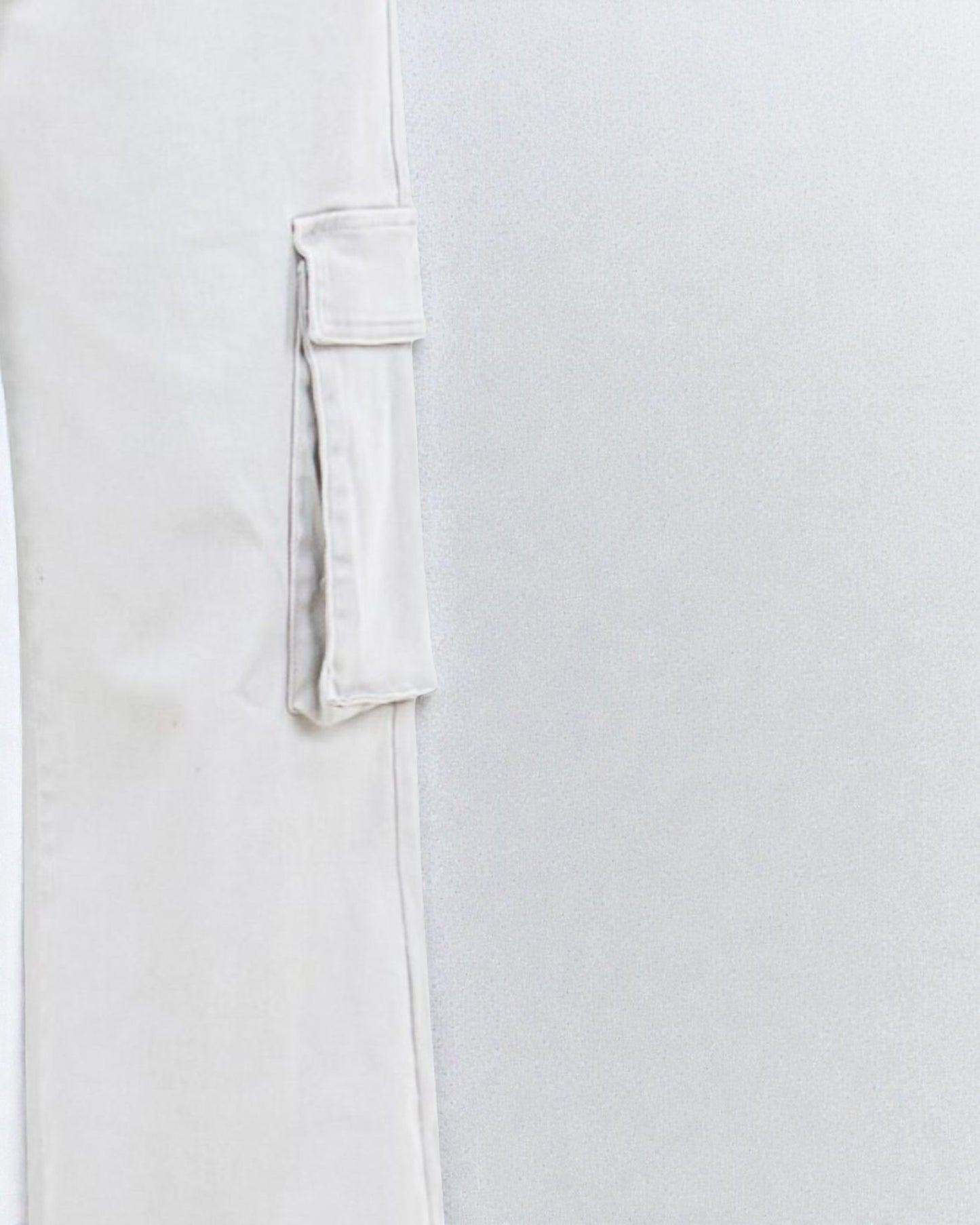 Close-up of a white shirt with a pocket on a light gray background