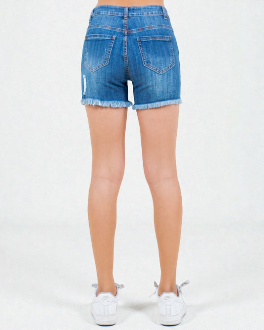 Blue denim shorts worn by a person on a white background