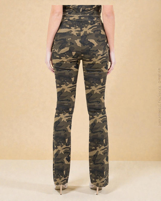 Camouflage pants worn by a person on a beige background