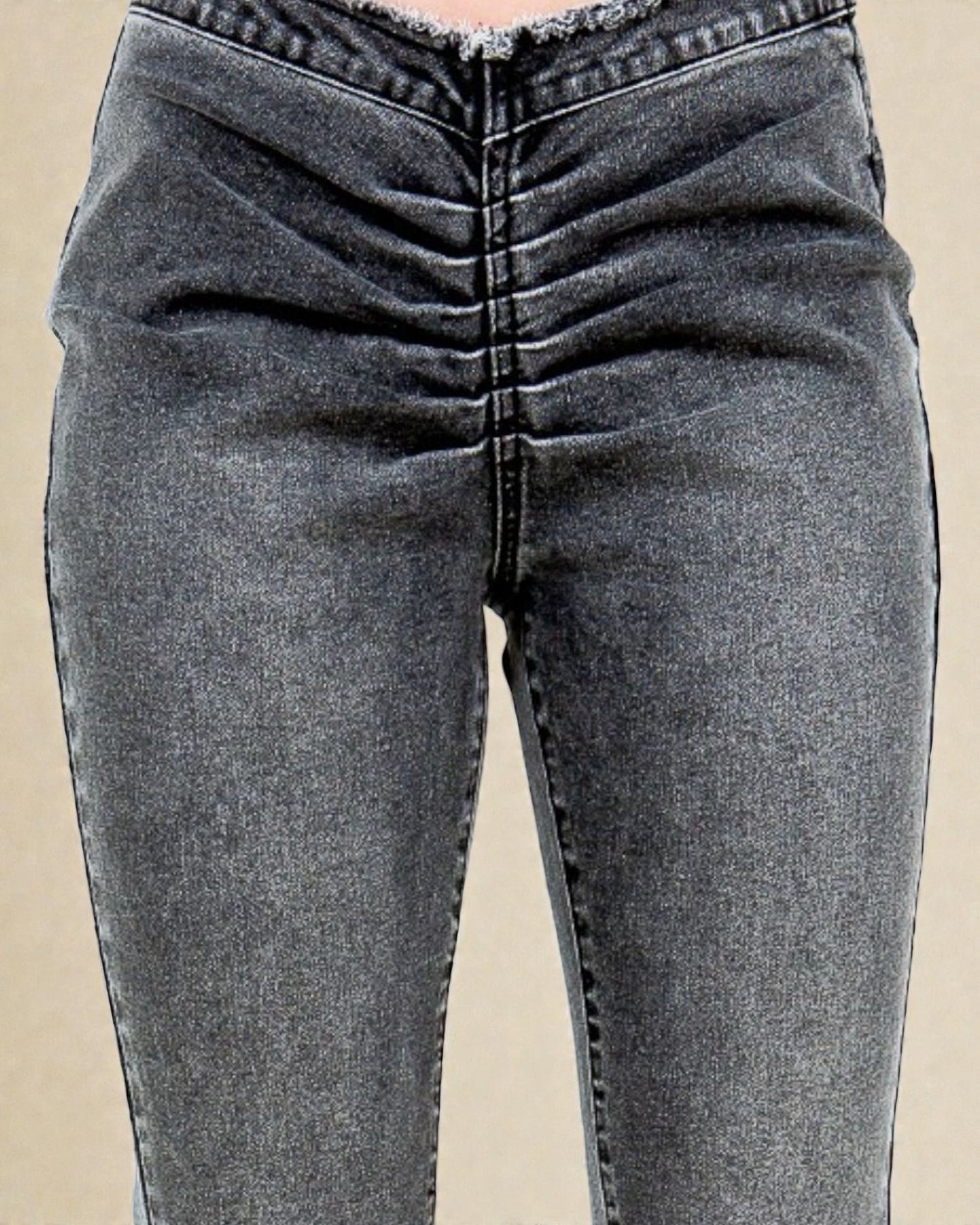 Gray jeans on a beige background