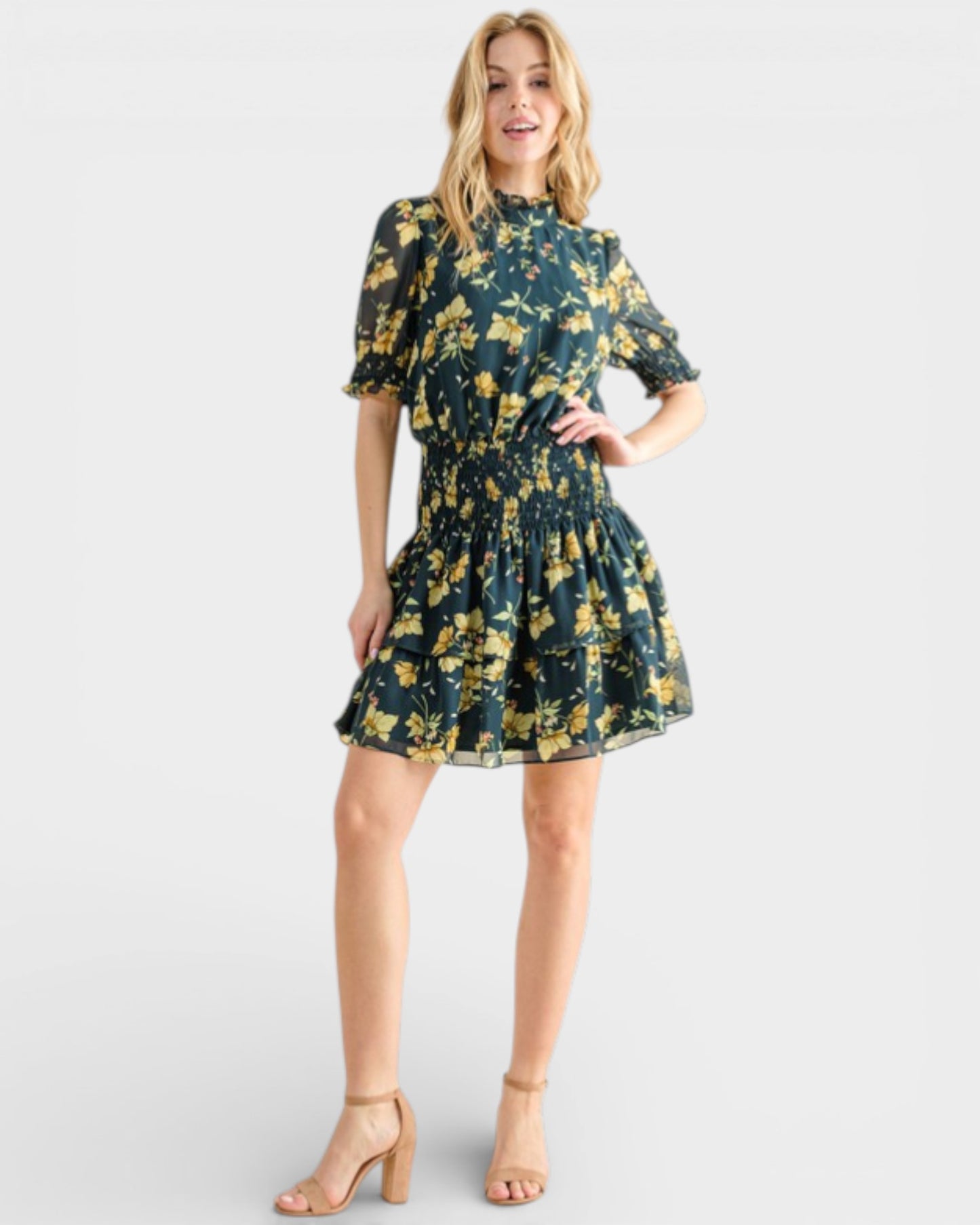 Woman wearing a floral dress on a white background