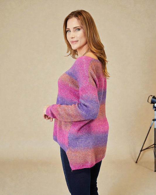 Woman wearing a colorful sweater against a beige background