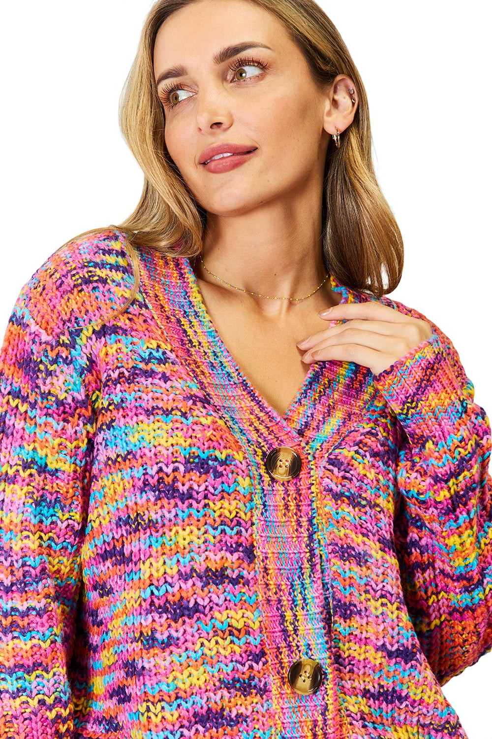 Woman wearing a colorful knitted cardigan on a white background