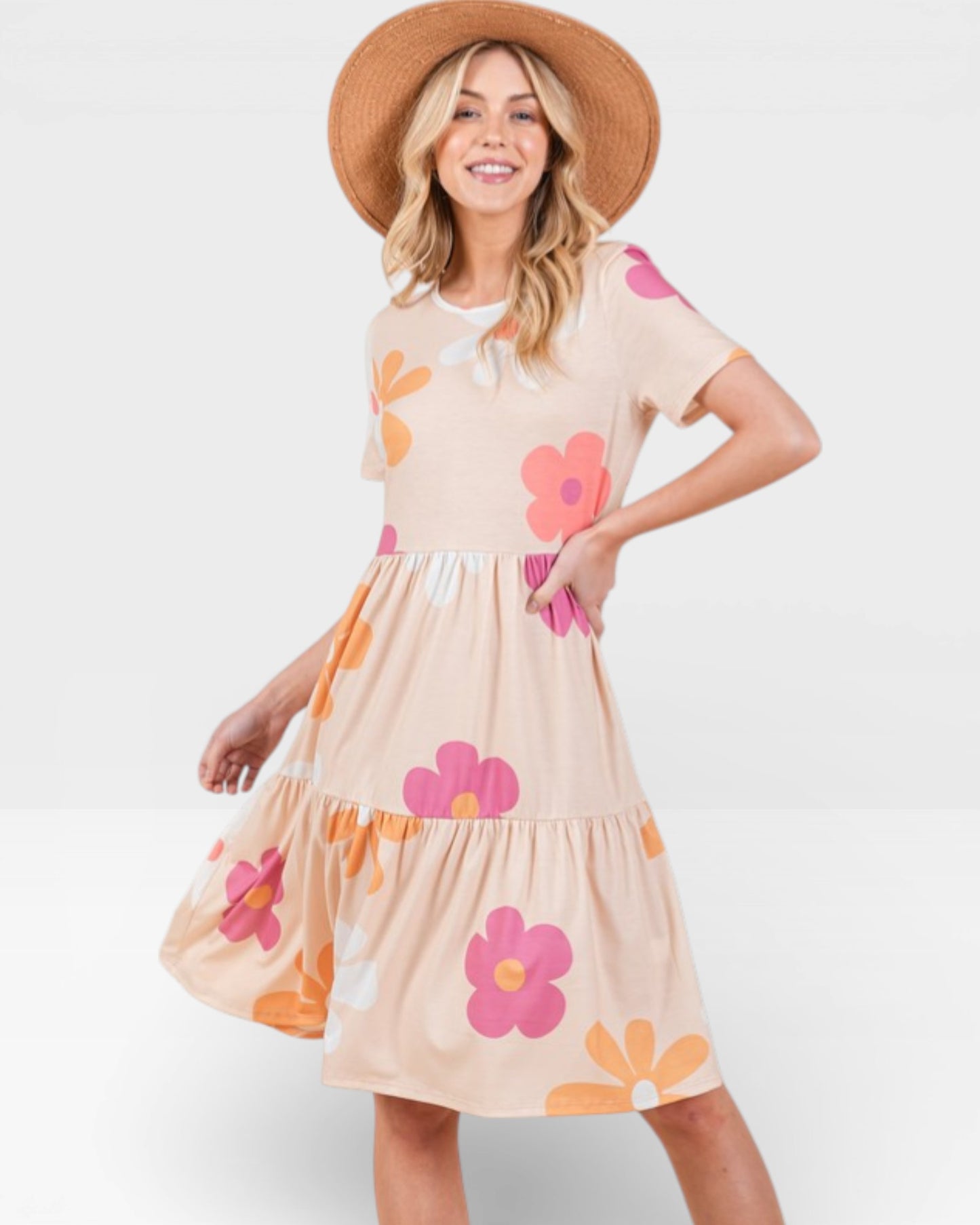 Woman wearing a floral dress with a white background