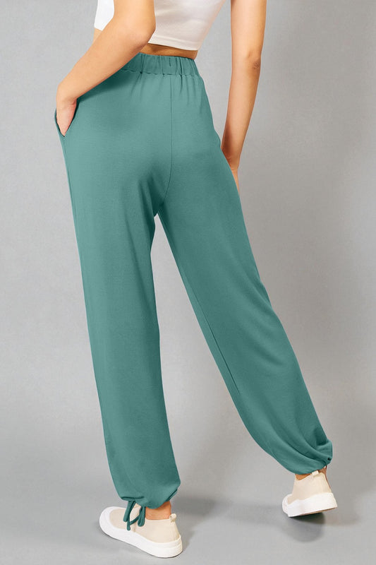 Pantalones de rayón suave con cordón en la cintura y bolsillos