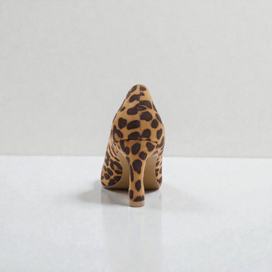 Leopard print high-heeled shoe on a white background