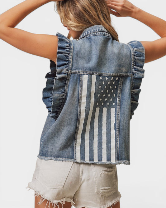 Denim vest with American flag design worn by a person on a plain background