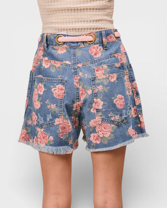 Floral denim shorts on a plain background
