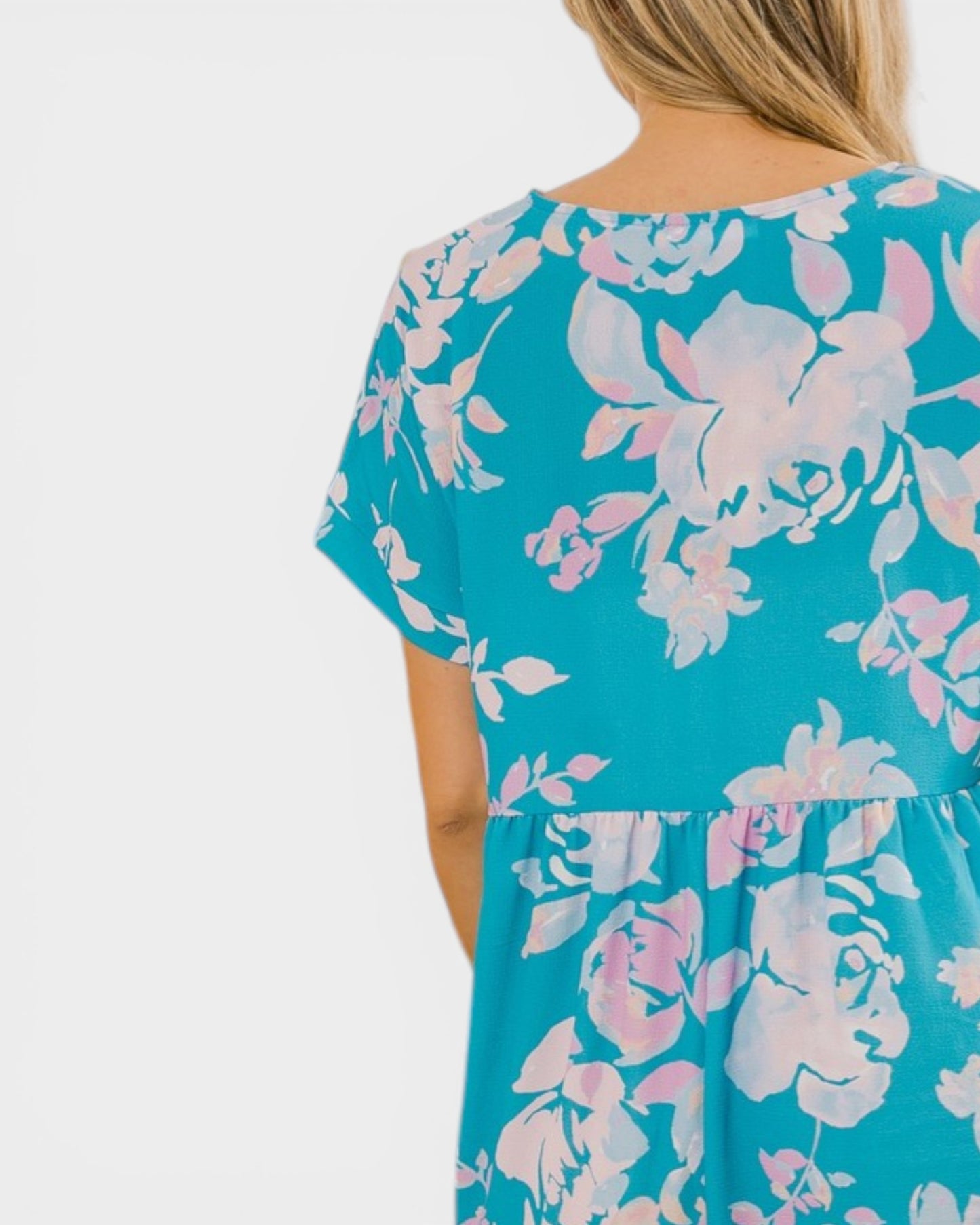 Blue floral dress with pink flowers on a white background
