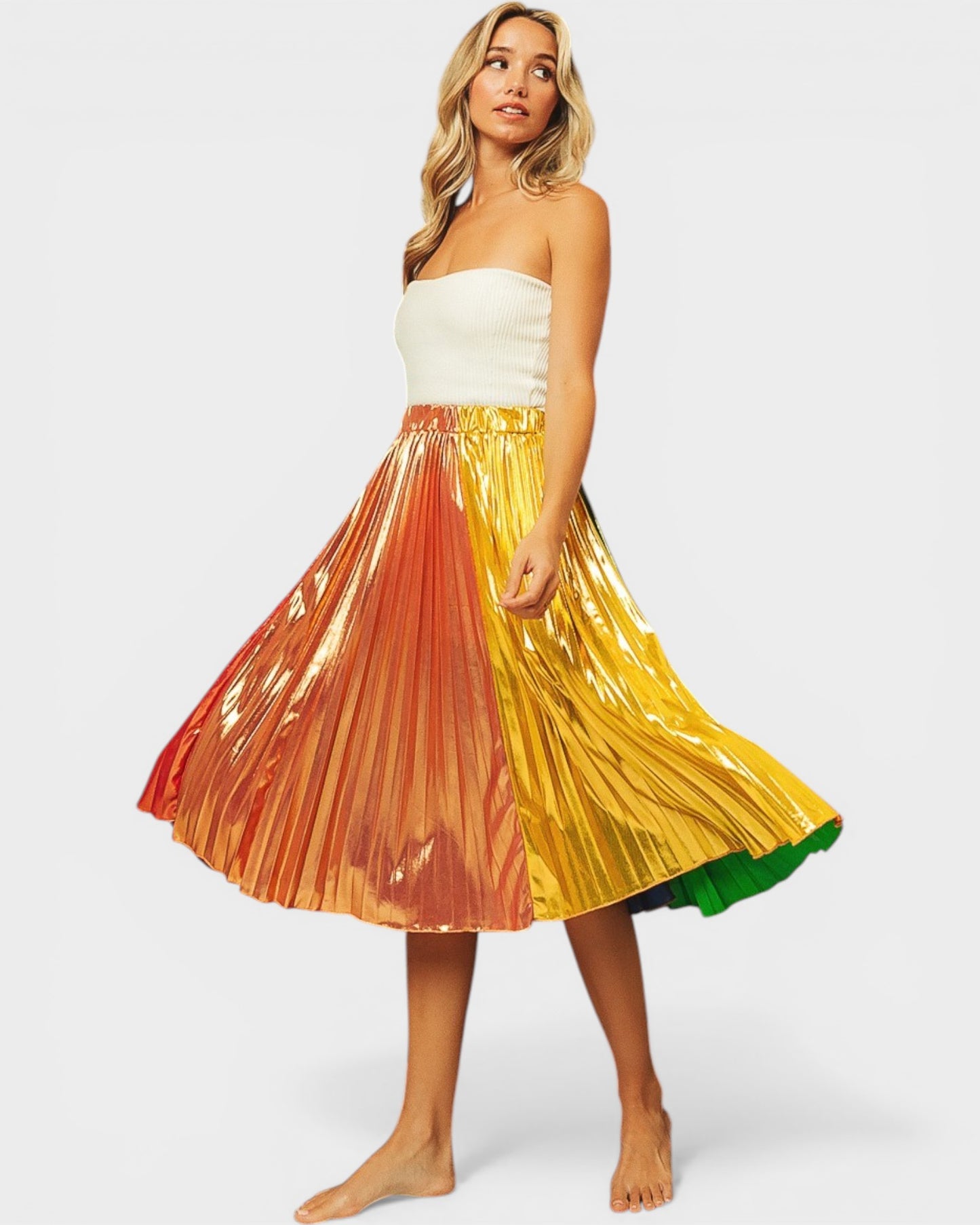Woman wearing a colorful pleated skirt on a white background