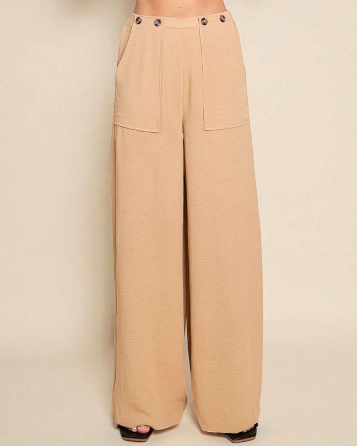 Beige wide-leg pants on a beige background