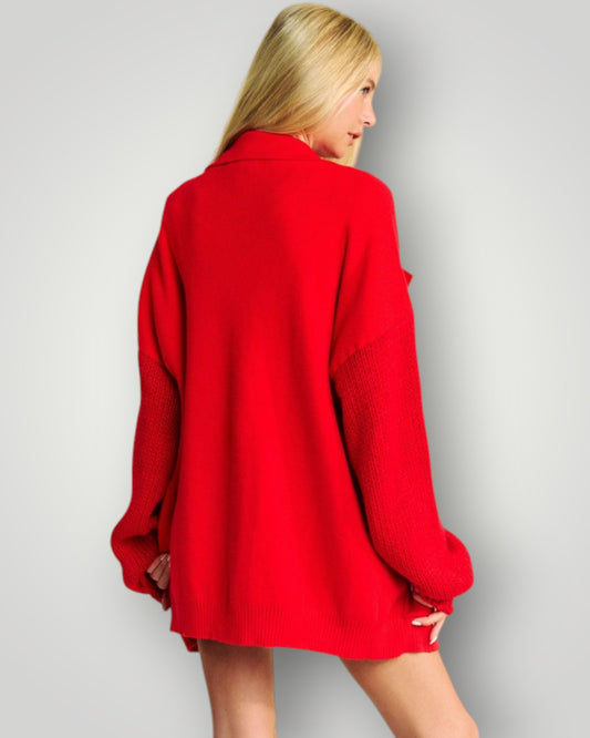 Person wearing a red coat on a plain background