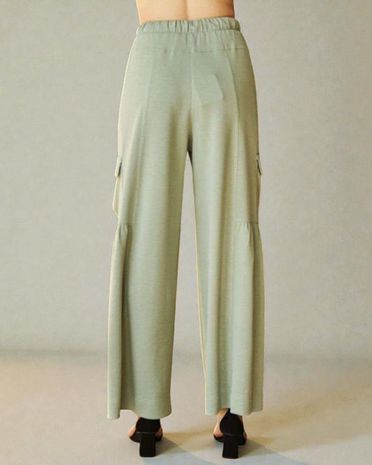 Light green cargo pants on a neutral background