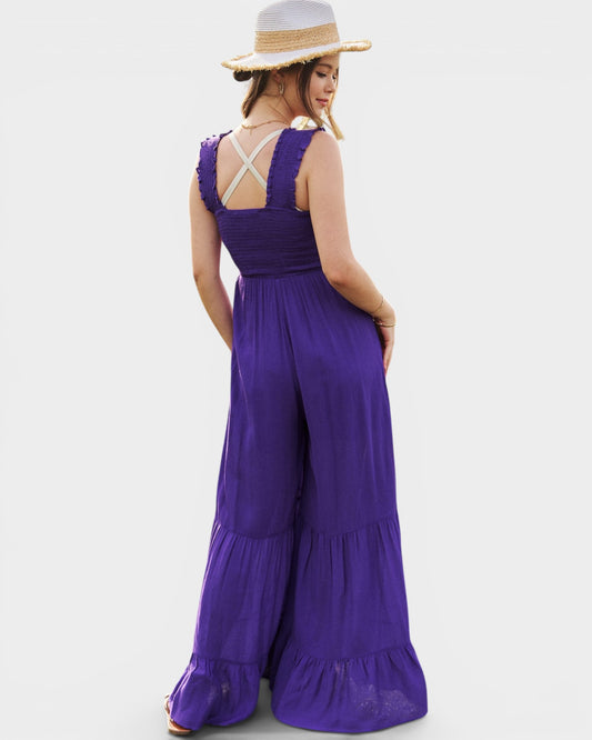 Woman wearing a purple dress with a white background