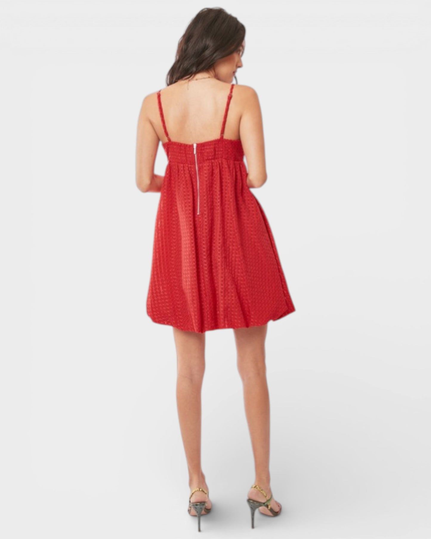 Woman wearing a red dress on a white background