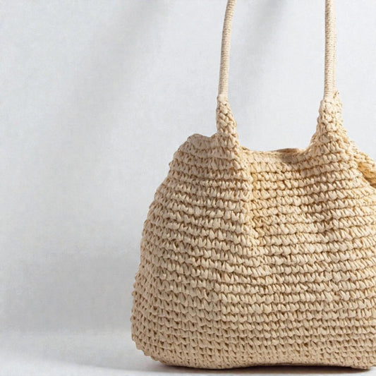 Beige woven handbag on a light gray background