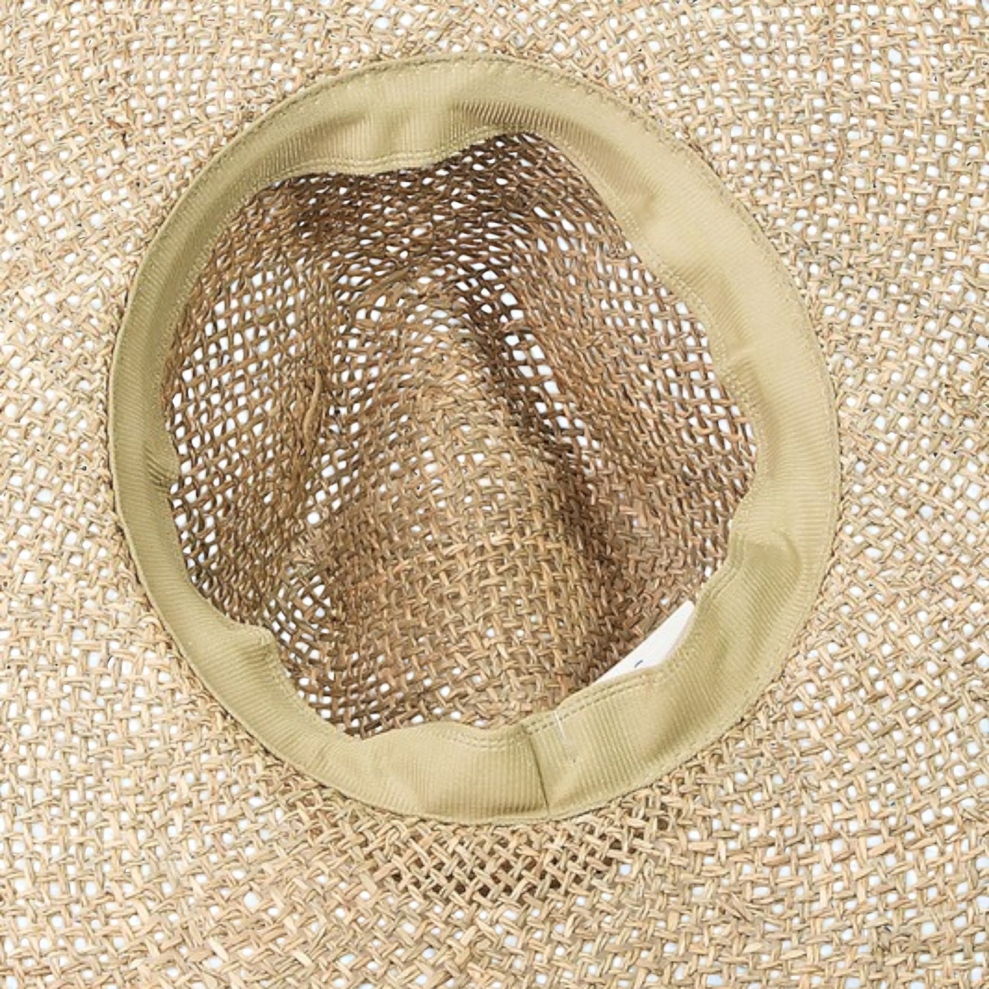 Close-up of a mesh screen on a textured beige background