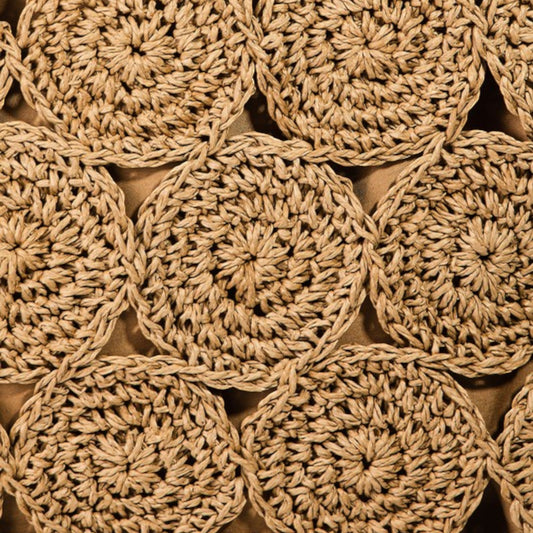 Close-up of beige crocheted circular patterns