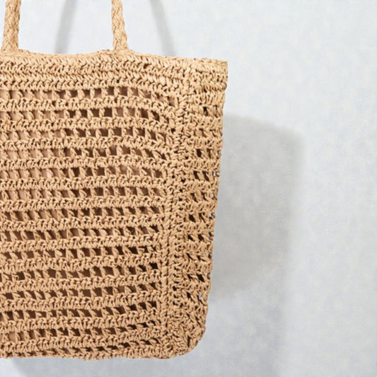 Woven straw bag on a white background