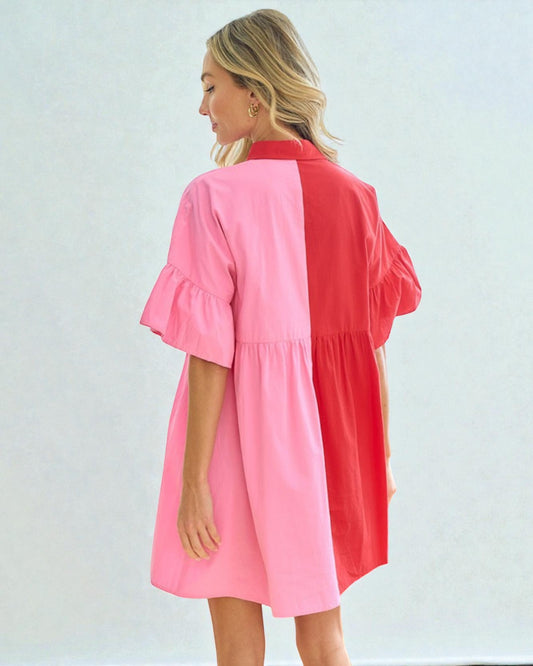 Woman wearing a pink and red dress against a white background