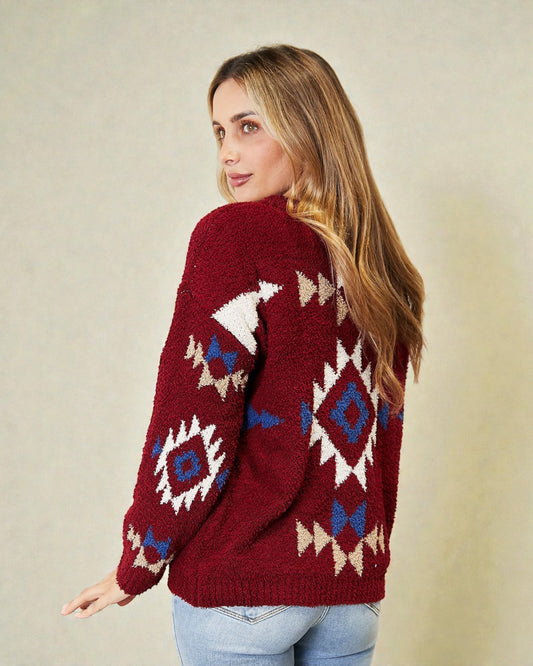 Woman wearing a red sweater with geometric patterns on a beige background