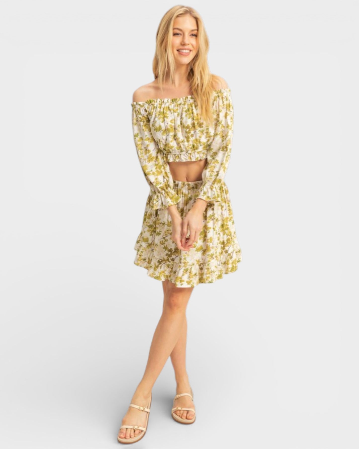 Woman wearing a floral dress on a plain background