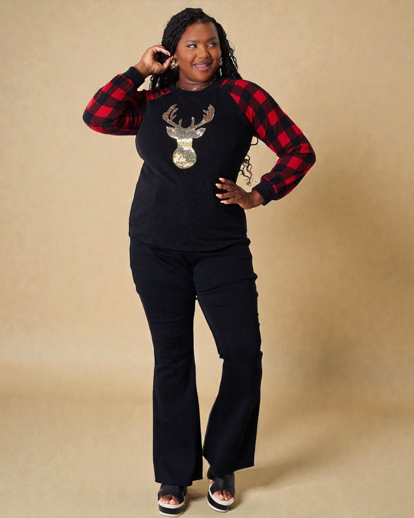Haut à carreaux noir à motif de renne à sequins