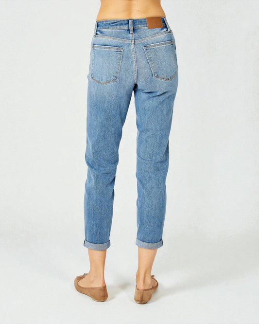 Light blue jeans worn by a person on a white background