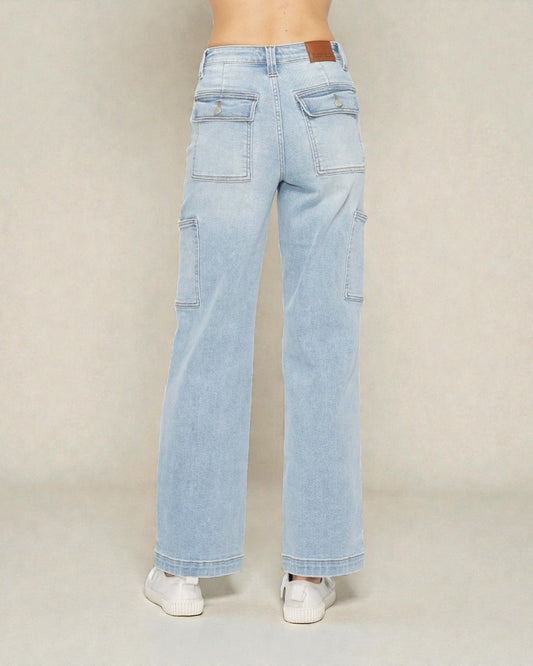 Light blue jeans worn by a person on a plain background