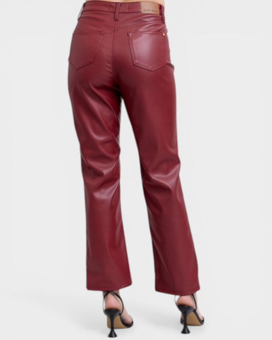 Maroon leather pants on a white background