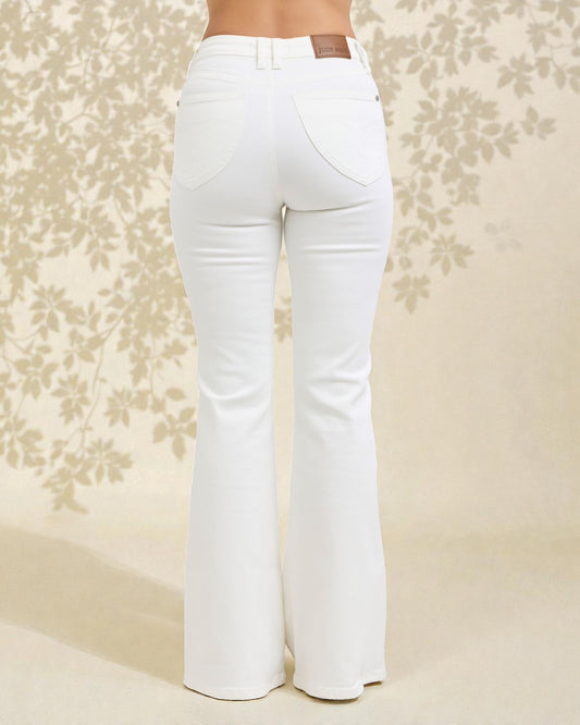 White flared jeans on a floral patterned background