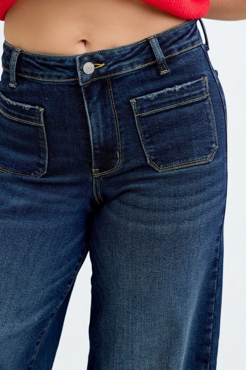 Close-up of blue jeans on a white background