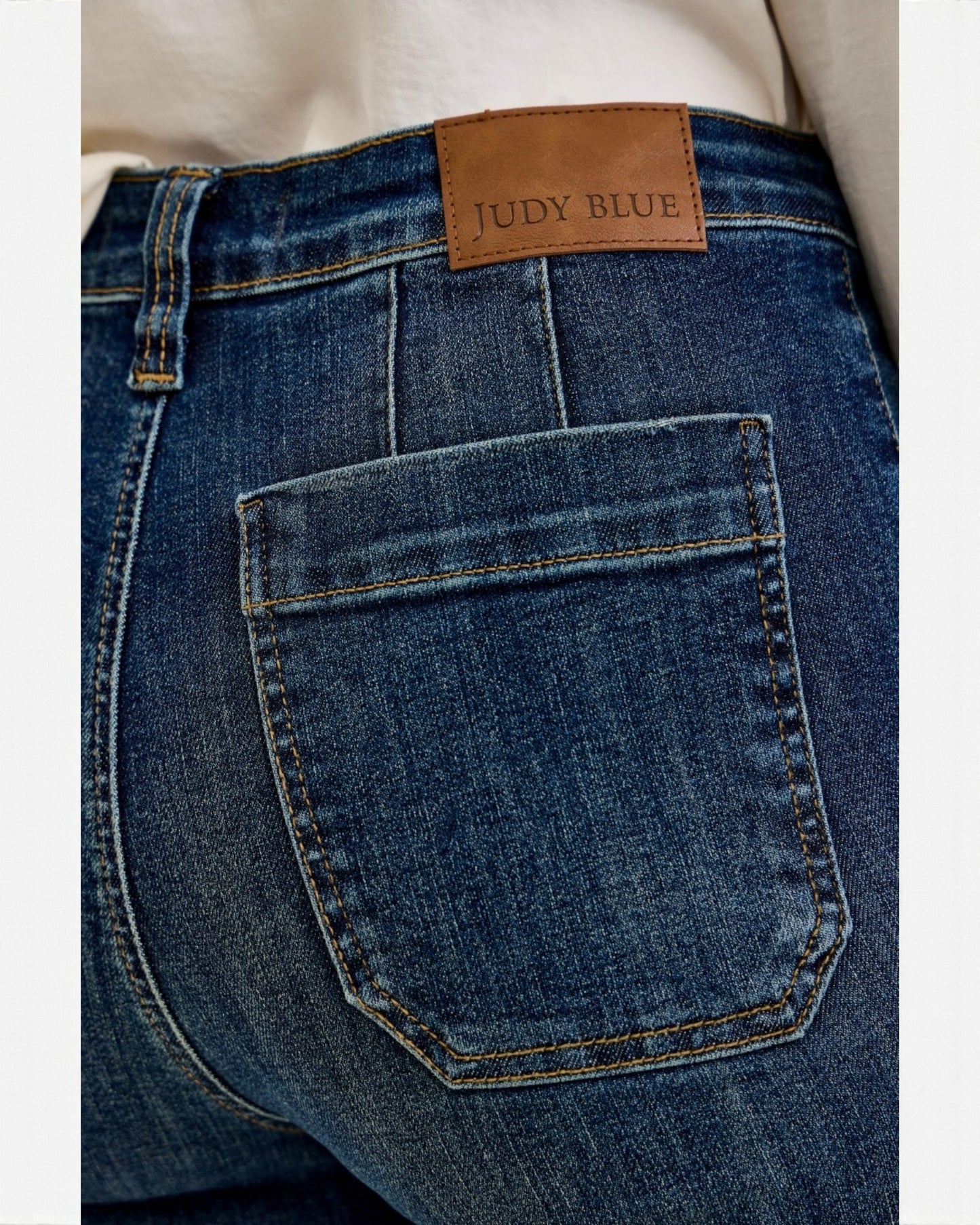 Close-up of blue jeans with a Judy Blue label on the pocket.