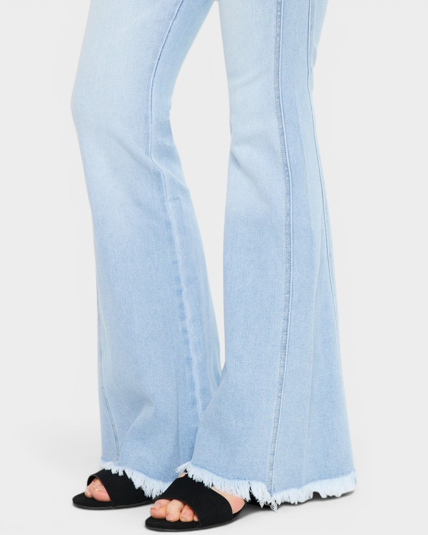 Light blue jeans with a white background