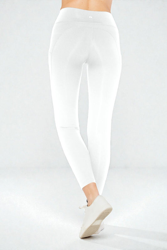 White leggings worn by a person on a light gray background